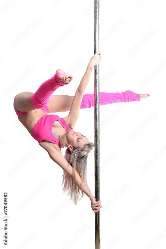 Young pole dance woman make twisted grip handspring isolated Stock Photo