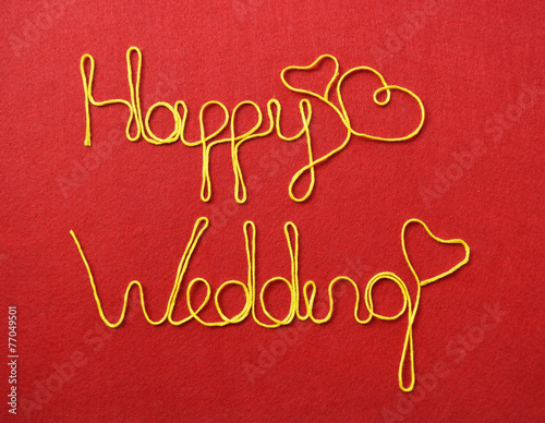 wedding ribbon greeting and hearts on red background