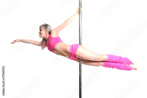 Young pole dance woman make superman isolated