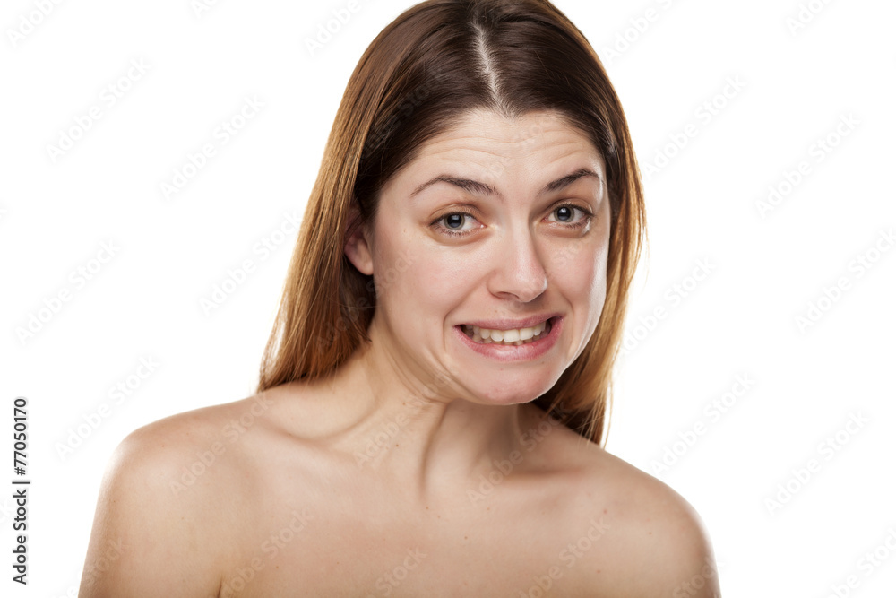 Beautiful young woman with a false smile Beautiful young woman with a false smile
