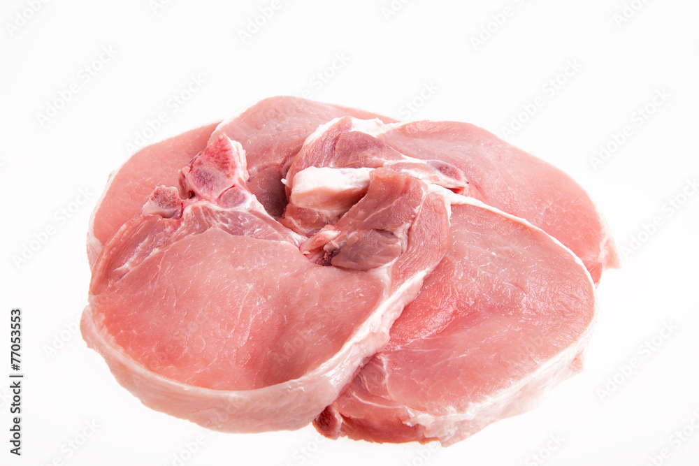 raw pork on a white background - copy space