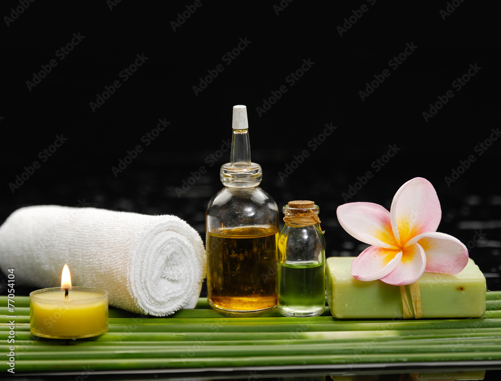 Spa set and long leaf on wet background Spa set and long leaf on wet background