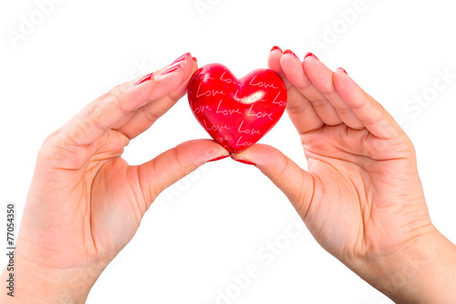 Heart shape in hands as love symbol
