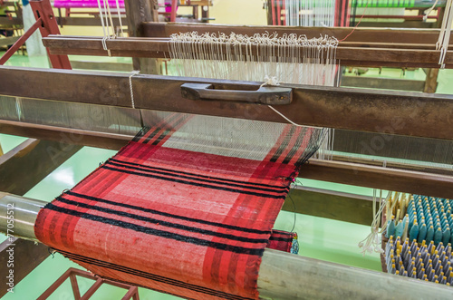 Obraz na płótnie Weaving loom and shuttle on the warp.