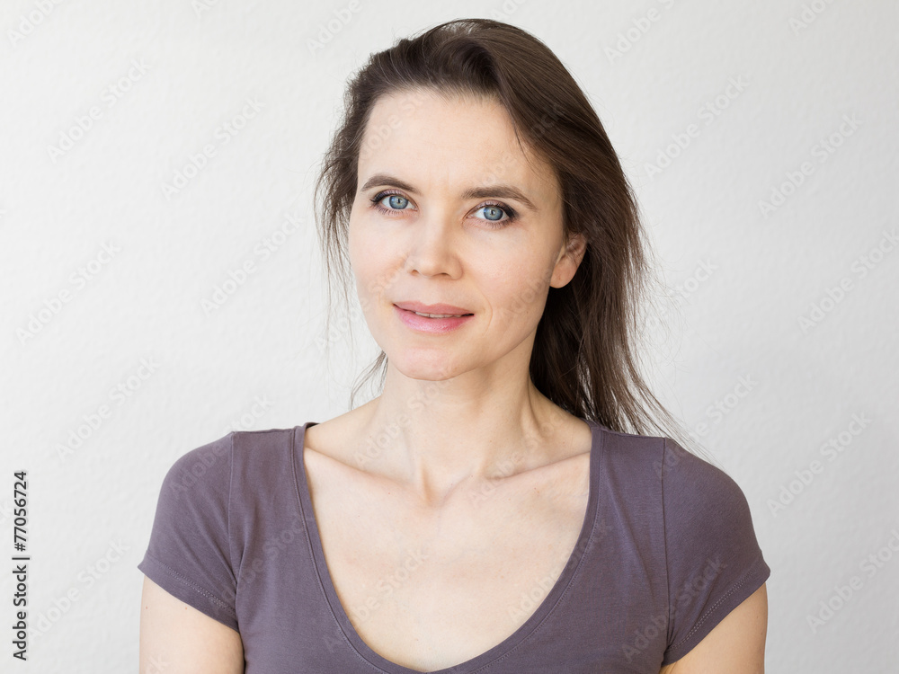 Woman with attractive smile looking into camera Woman with attractive smile looking into camera