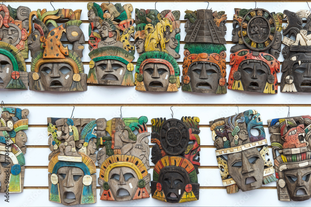 Obraz premium Mayan woodeMayan wooden handcrafted masks on the street market 