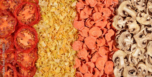 Dried  tomatoes, carrots, onions and mushrooms background