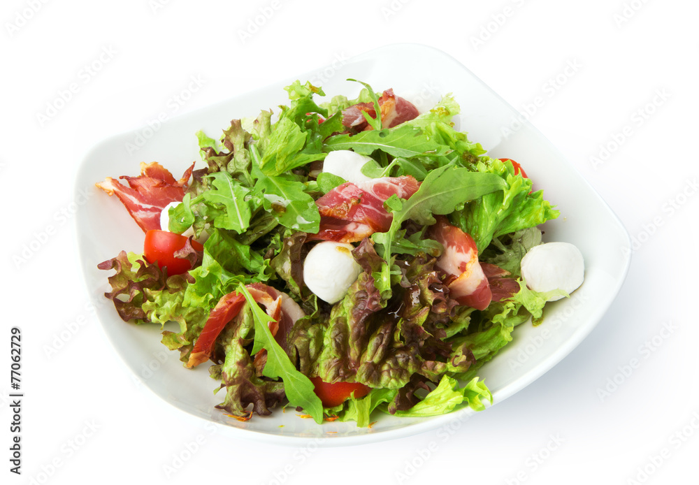 Restaurant food isolated - salad with spanish jamon and mozzarel Restaurant food isolated - salad with spanish jamon and mozzarel