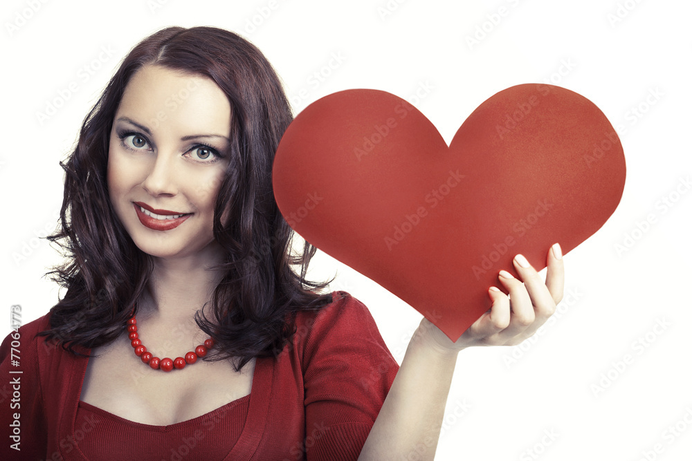 Young attractive woman holding heart and smiling Young attractive woman holding heart and smiling
