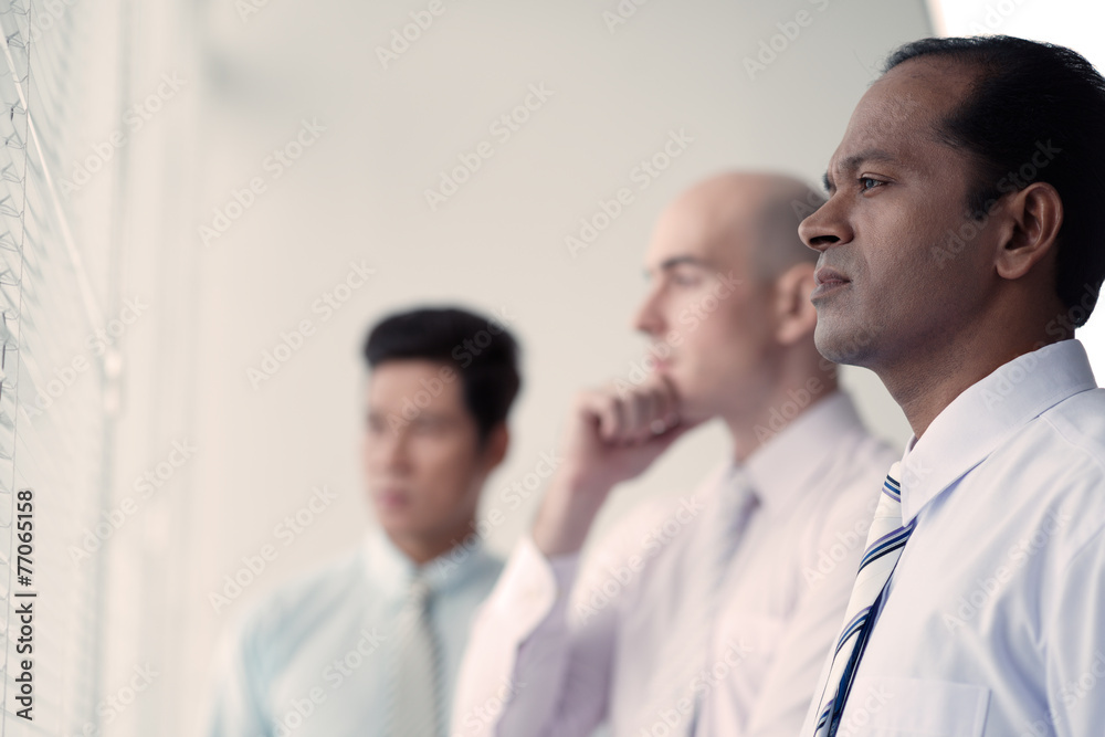 Contemplating business people Contemplating business people