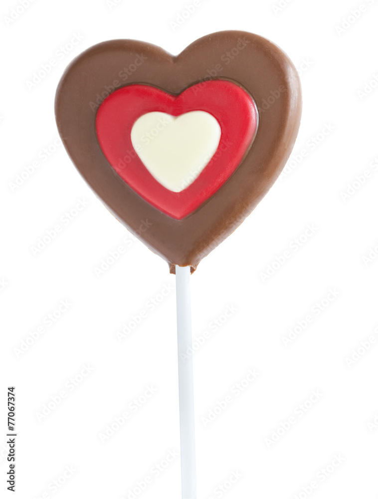 Chocolate heart lollipop isolated on white Chocolate heart lollipop isolated on white