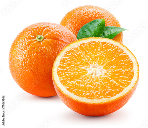 Orange fruit with wet leaves isolated on white