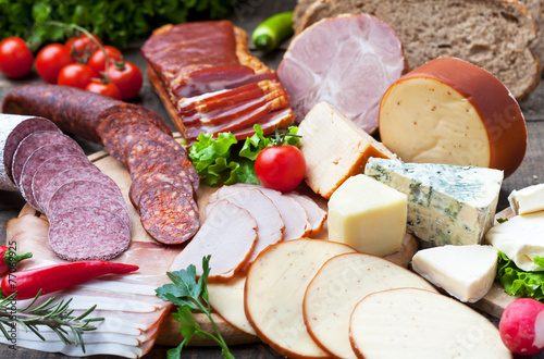 Ham, salami, sausages and cheese with bread and tomato