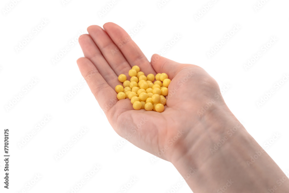 Close-up of hand holding pills Close-up of hand holding pills