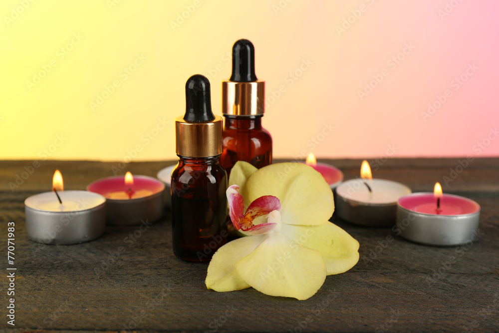 Bottles with aromatic oils and candles