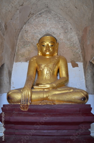 Ancient golden Buddha. Statue of 13th century. Bagan, Myanmar