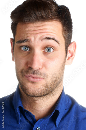Young man making a funny face over a white background