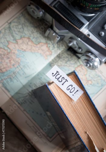"Just go" book, map, camera, travel concept, vintage