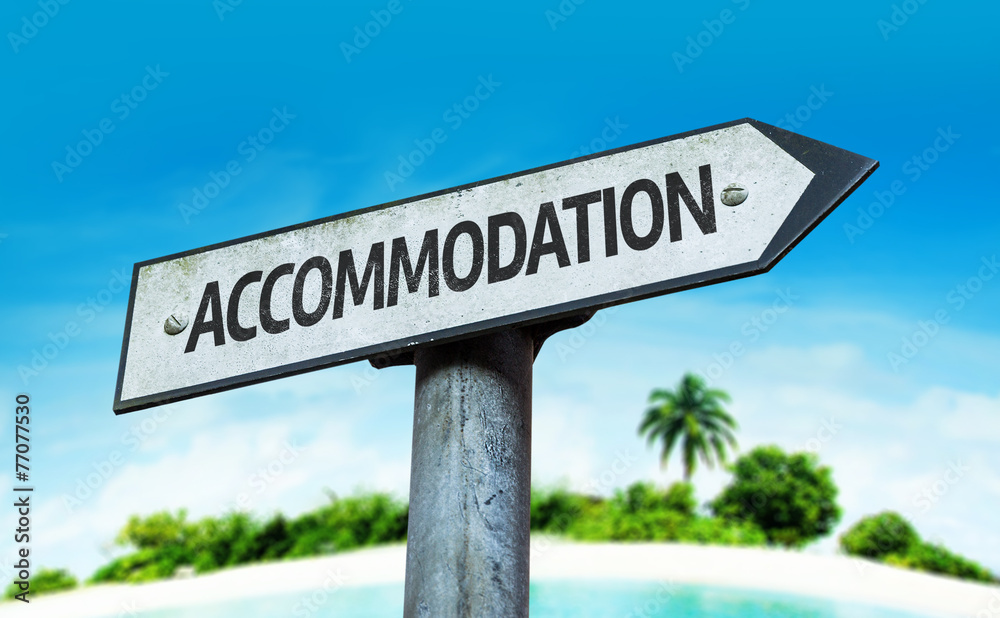 Accommodation sign with a beach on background