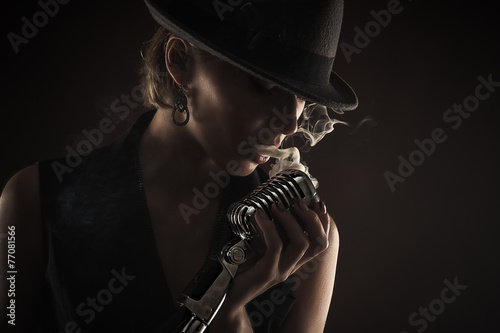 silhouette singer woman with retro microphone
