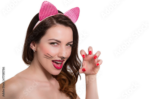 Catwoman makeup on beautiful girl. Pink lipstick, nail polish is