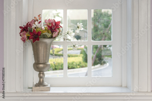 vase of flower with window frame