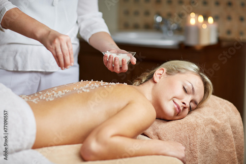close up of woman lying and having massage in spa