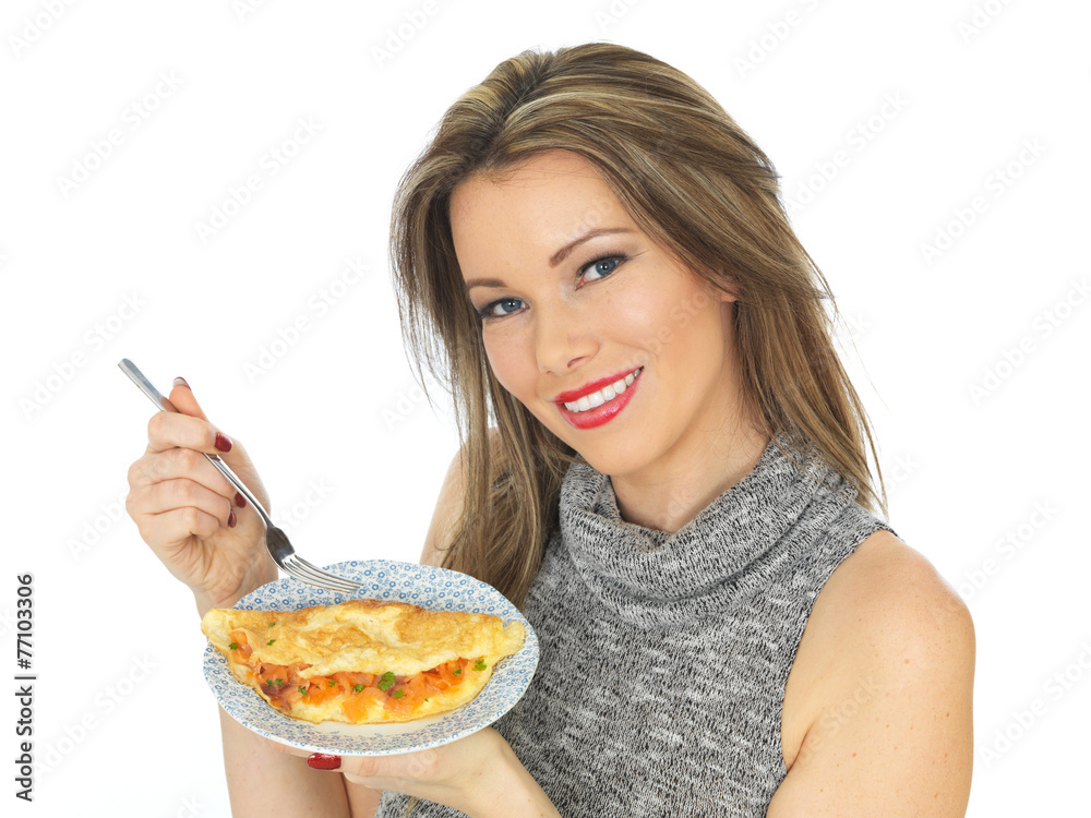 Young Woman Eating a smoked Salmon Omelette Young Woman Eating a smoked Salmon Omelette