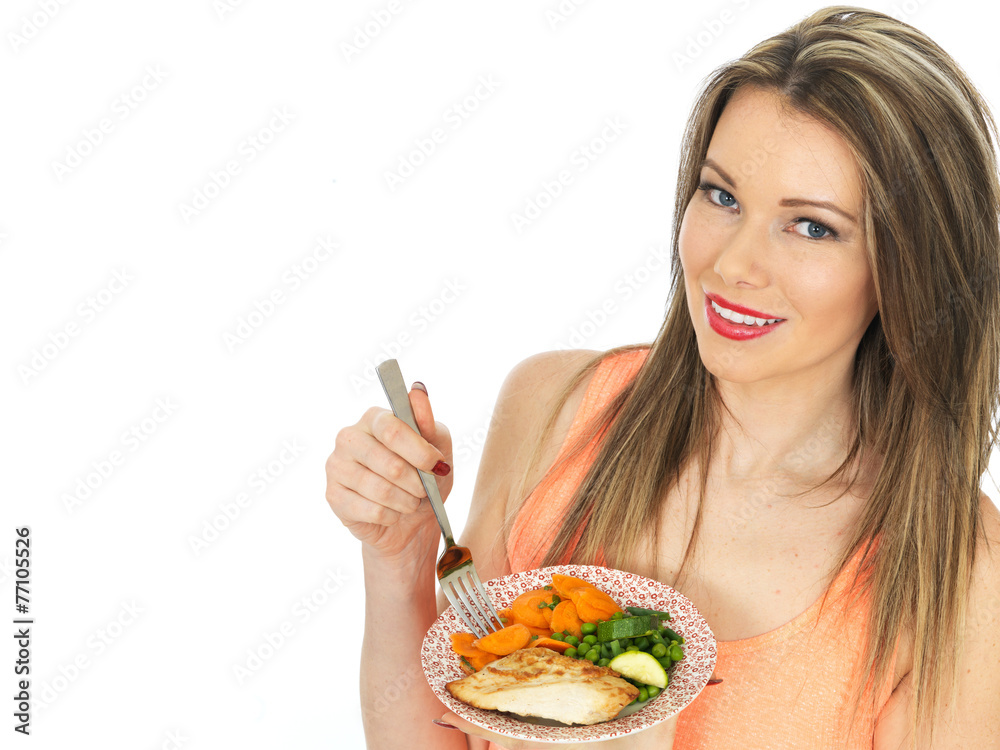 Young Woman Eating Grilled Chicken with Vegetables Young Woman Eating Grilled Chicken with Vegetables