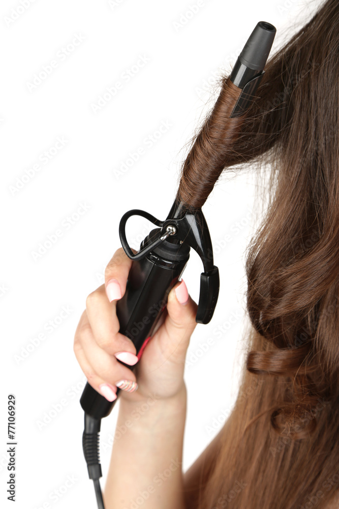 Young beautiful girl doing hairstyle, close up, isolated