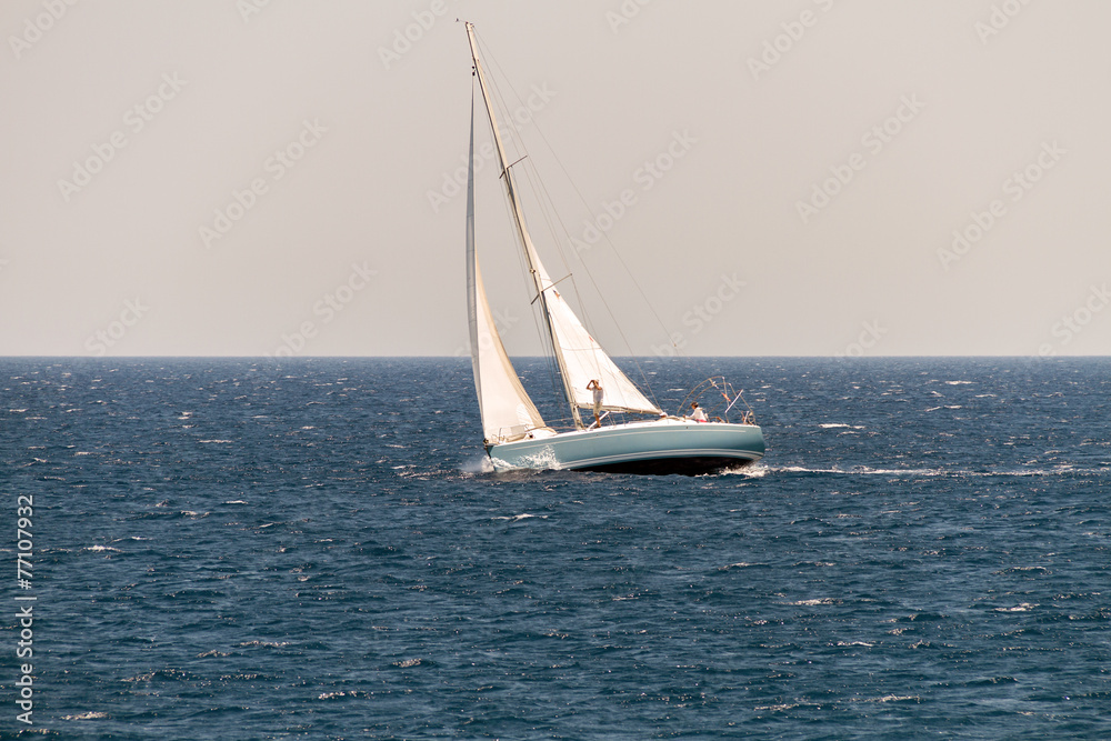 Sailing Vessel in Deep Blue Ocean