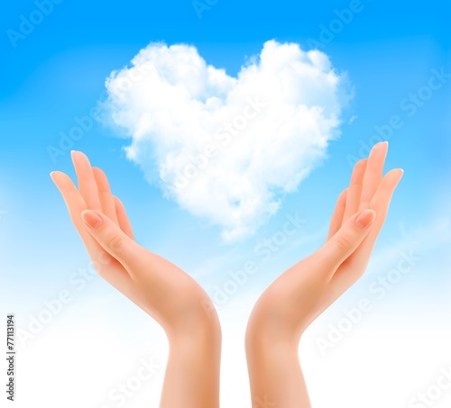 Holiday valentine background with hands holding heart shaped clo