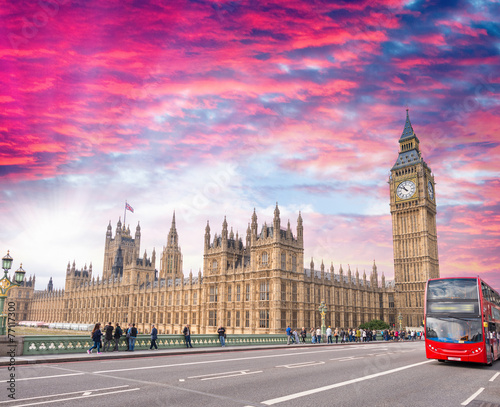 Red bus crossing Westminster Bridge, London