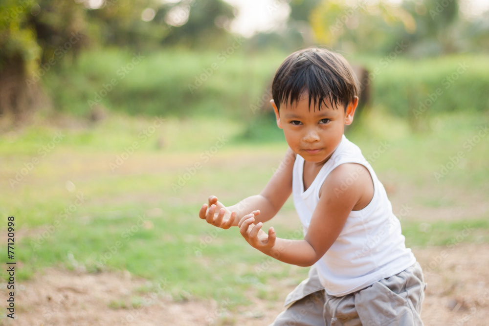 happy young asia boy playing kungfu having fun happy young asia boy playing kungfu having fun