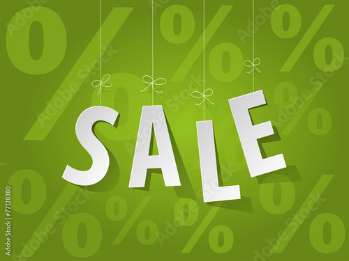 SALE paper letters on a green background