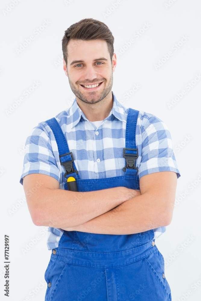 Male handyman standing arms crossed