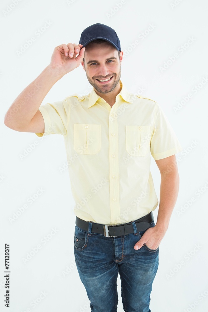 Happy delivery man wearing baseball cap Happy delivery man wearing baseball cap