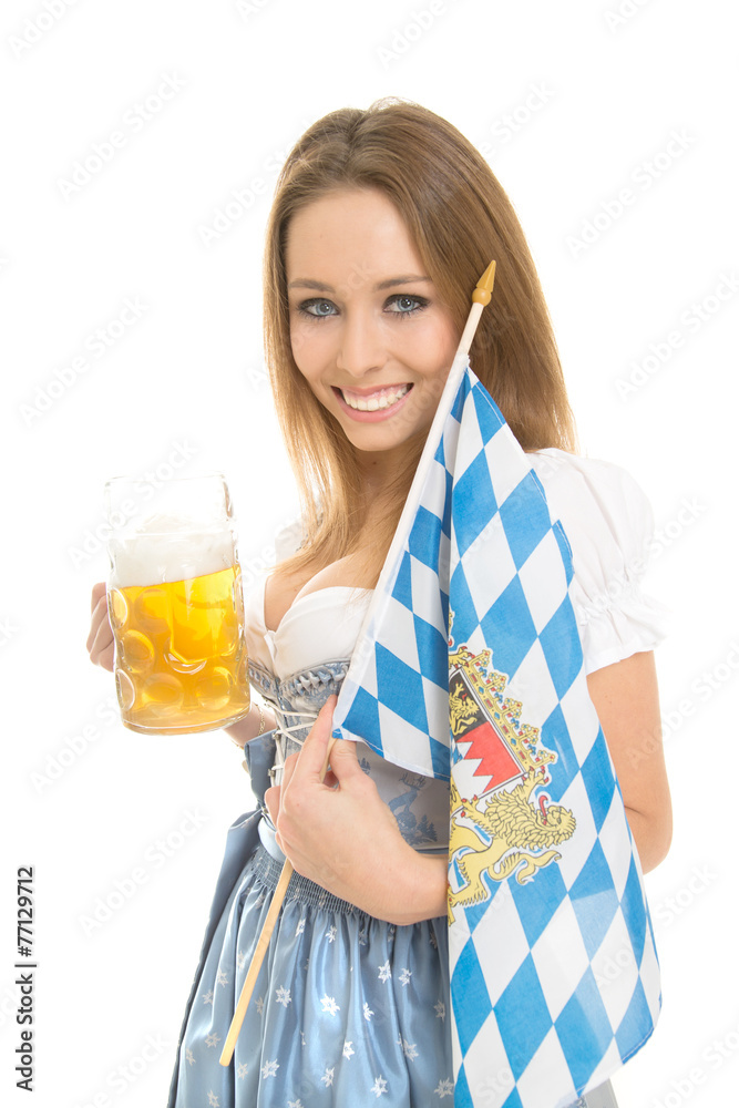 Junge Frau im Dirndl mit einer Maß in der Hand Junge Frau im Dirndl mit einer Maß in der Hand