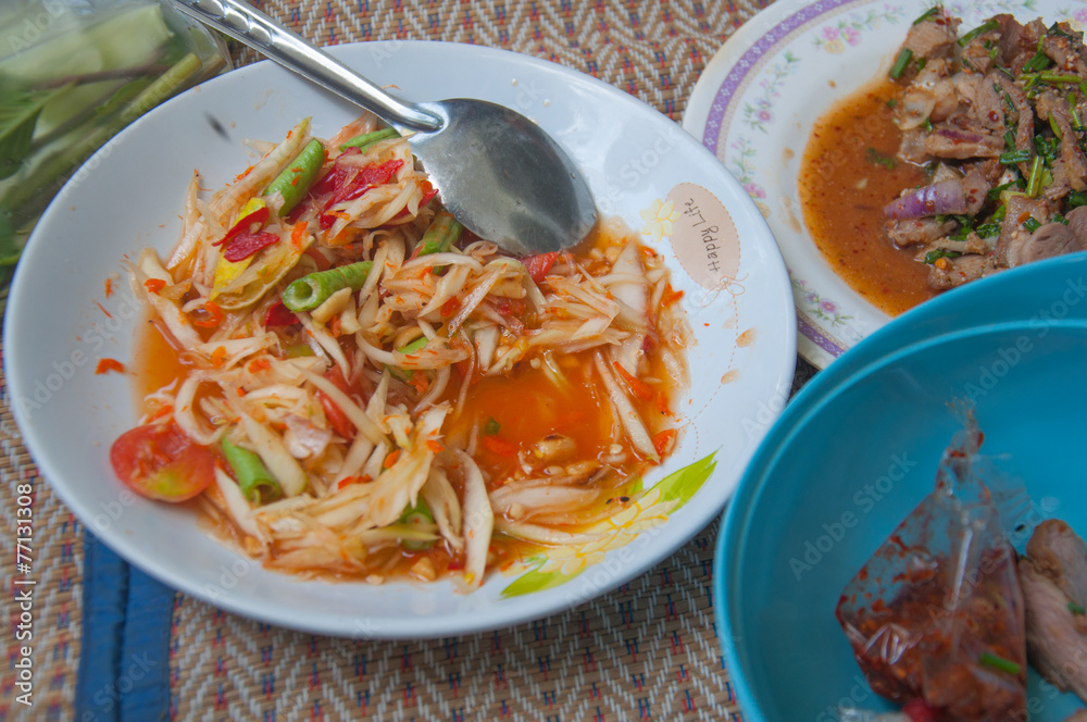 Hot and spicy papaya salad, Thai cuisine Hot and spicy papaya salad, Thai cuisine
