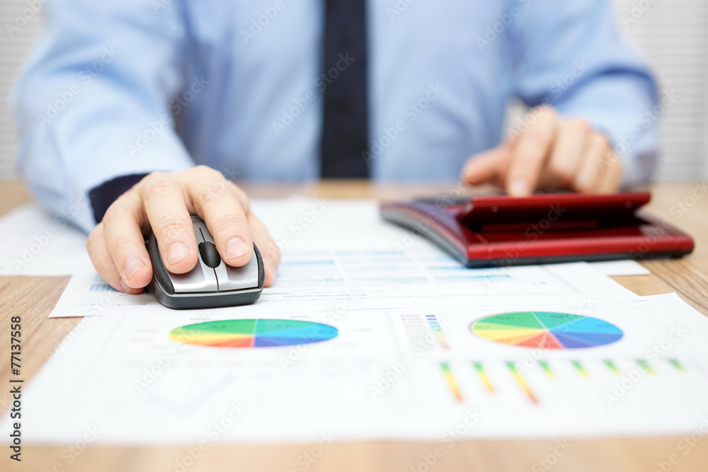 businessman is calculating data and using computer to insert fin businessman is calculating data and using computer to insert fin