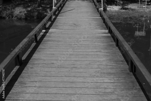 small wooden bridge across the lake