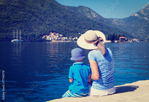 mother and son looking at scenic sea view