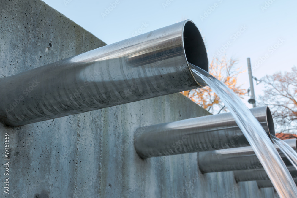 Water flowing out from steel pipes - obrazy, fototapety, plakaty 