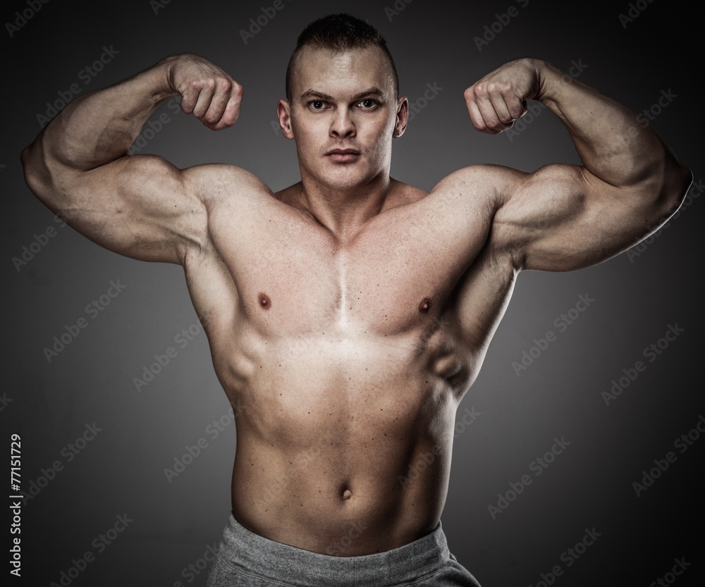 Handsome man with muscular torso posing Handsome man with muscular torso posing