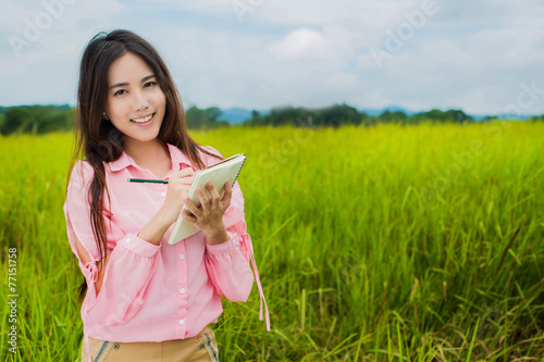 woman holding a notebook
