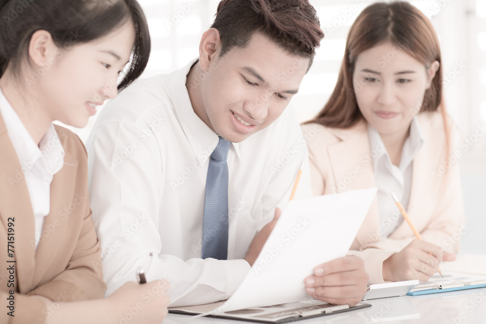 Business people discussing the charts and graphs showing the res Business people discussing the charts and graphs showing the res