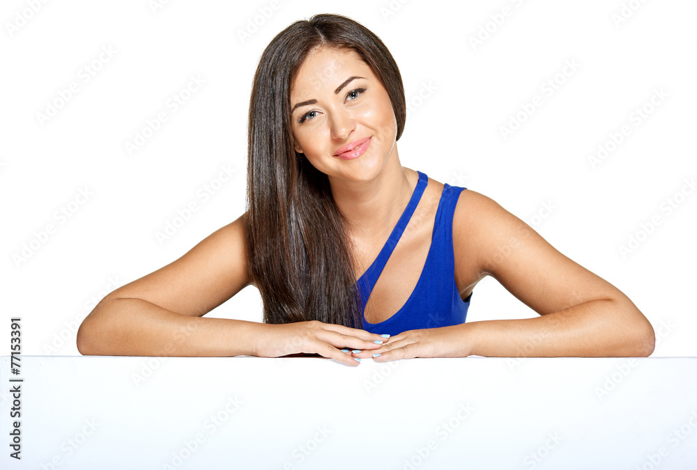 Young pretty woman peeking out from behind the wall Young pretty woman peeking out from behind the wall