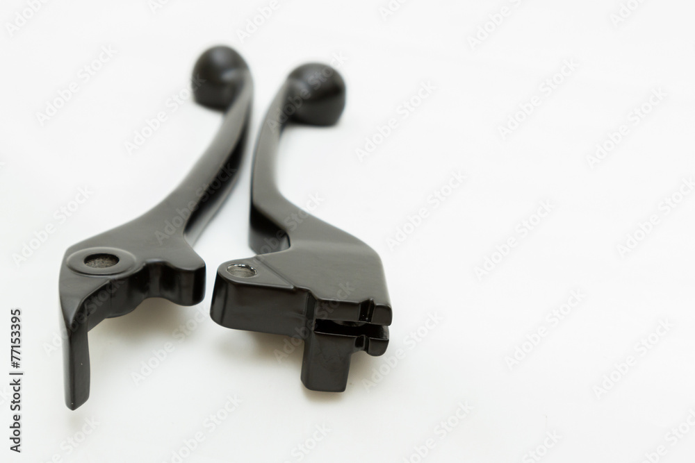 A black motorcycle lever isolated on white A black motorcycle lever isolated on white