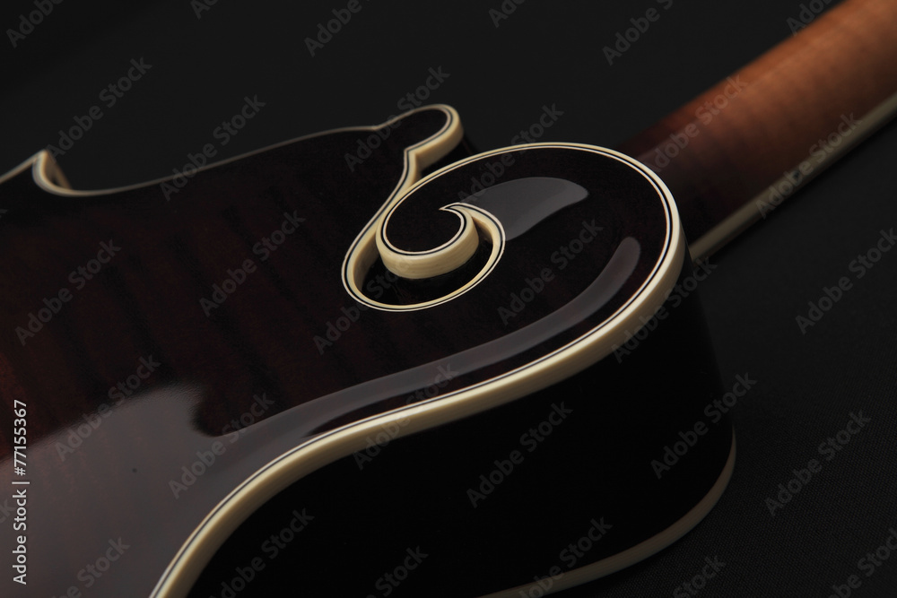 Fototapeta premium Mandolin isolated on black, detail