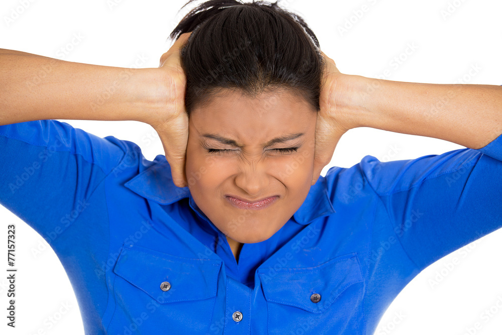 Frustrated stressed young woman having headache screaming Frustrated stressed young woman having headache screaming